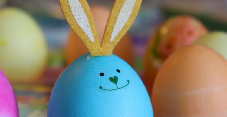 blue egg with smiling rabbit design