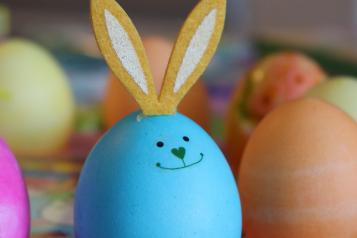 blue egg with smiling rabbit design