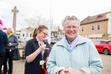 volunteers - one older woman, one younger woman